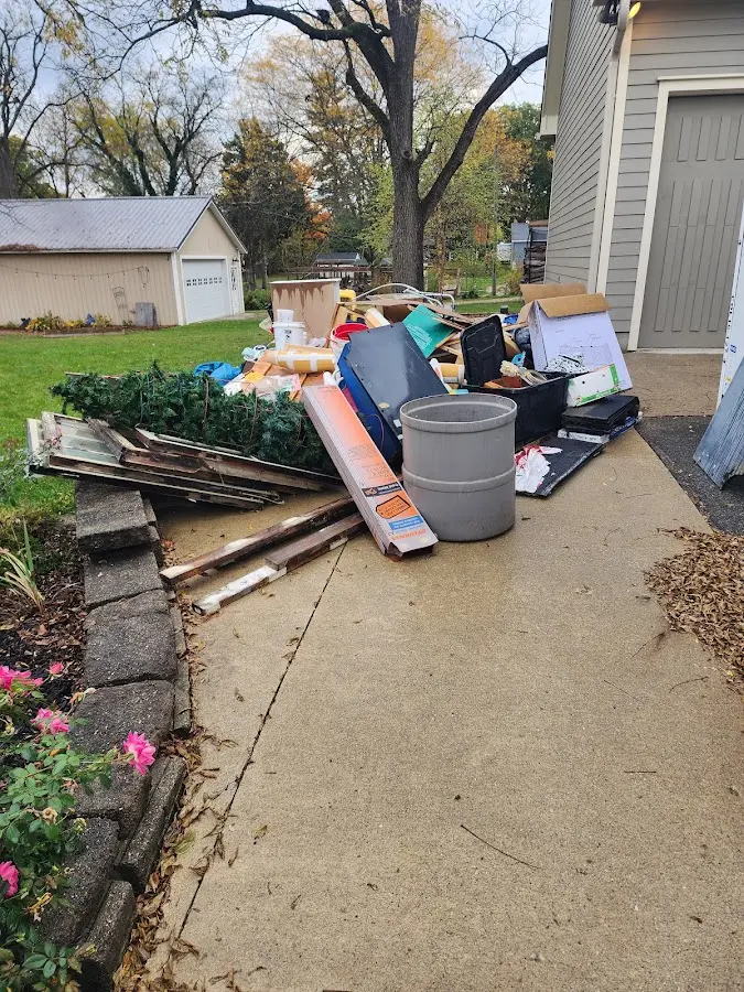 Dumpster being loaded with debris for Demolition Dumpster Rental in Oakhurst